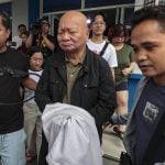 ARRESTED VETERAN JOURNALIST / OCTOBER 24, 2026 Veteran journalist Philip Lustre Jr., escorted by police officers, leaves the