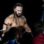 Wrestler Benjamin Satterley arrives at the 2017 WWE Live Duesseldorf. He is shirtless, has long brown hair, a beard and is