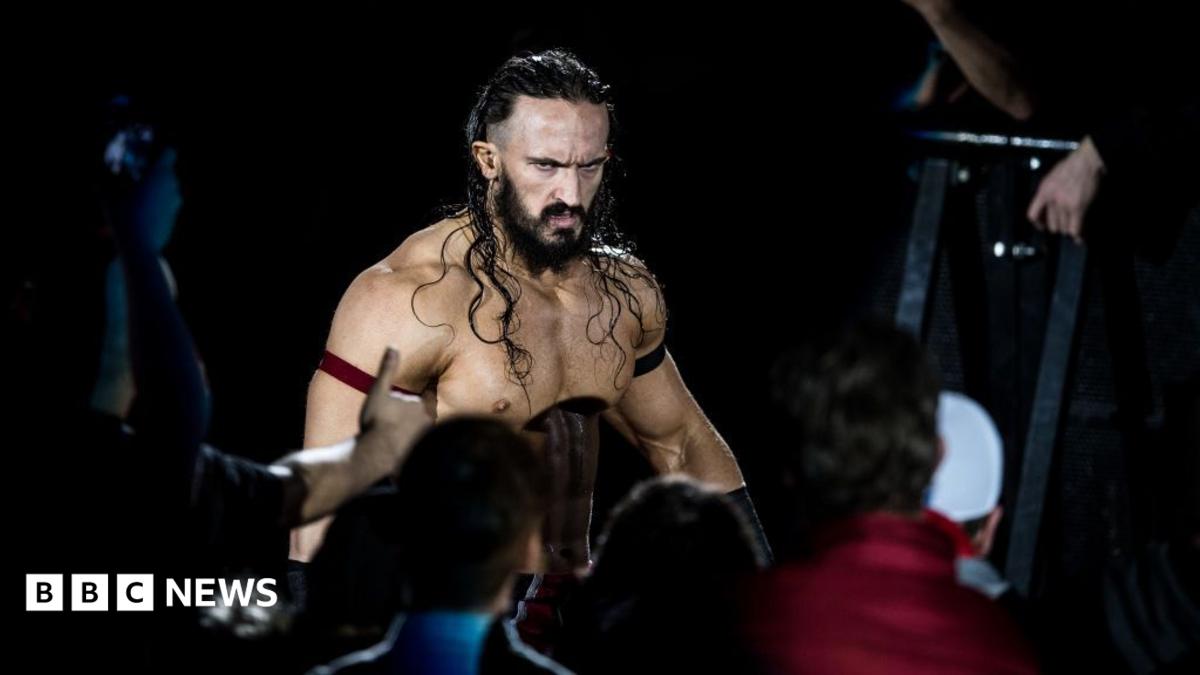 Wrestler Benjamin Satterley arrives at the 2017 WWE Live Duesseldorf. He is shirtless, has long brown hair, a beard and is